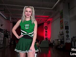 Busty cheerleader gives a dirty talk while masturbating
