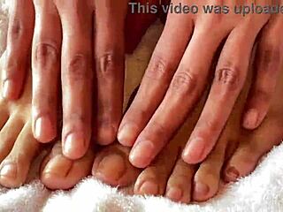 clear nails contrast with barefoot asian toes during european fetish fingering