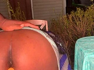 An ebony woman creates a veggie dildo for her solo pussy masturbation fetish session.