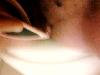 A girl in a home video enjoys some private relaxation.