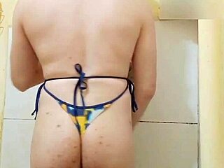 Feminine trans woman with dental issues in bikini
