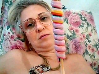 Stella Still's sensual oral exploration with a lollipop