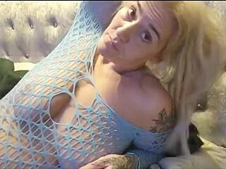 Horny babe with shaved pussy teases with fishnet outfit