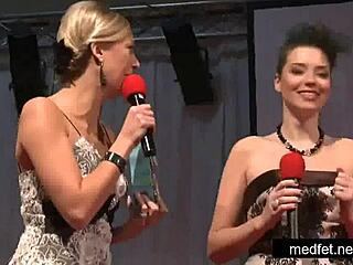 Female and male strippers undress and dance erotically, teasing the audience with striptease and clothes ripped.