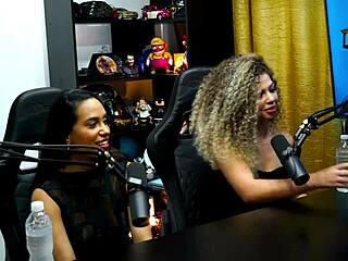 Daniely and Patricia share a passionate kiss during a podcast, leaving the host speechless