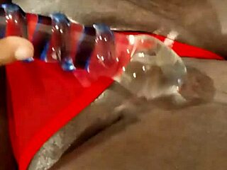 ebony milf masturbating with dildo in lingerie.