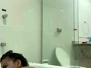 i'm bia hot brunette relaxing with the shower jet in the bath