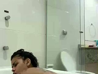 i'm bia hot brunette relaxing with the shower jet in the bath