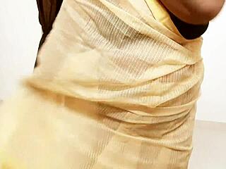 Sexy Indian aunty in saree seduces with stunning curves. Her charm captivates everyone around.