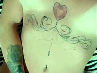 Tattooed hot girl shows tan lines