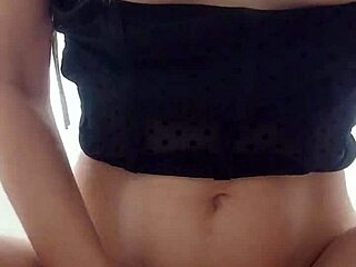 Skinny chick tries on clothes and masturbates in the fitting room at the mall