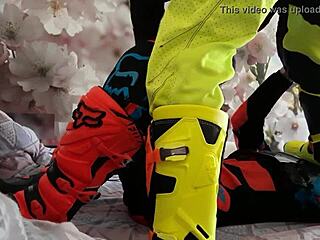 Gay biker treads boots in motocross costume?