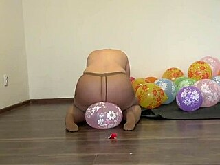 a fat girl in pantyhose sits down on balloons and pisses