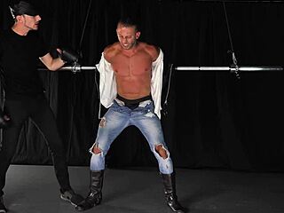 Muscular hunk gets tied up and teased in gay BDSM scene