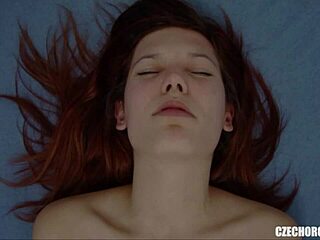Red-haired woman masturbates and has an orgasm