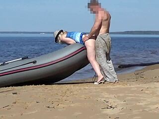 Tourist and boatman have fun at the beach
