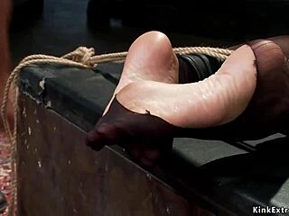 A mature woman is tied up and has anal sex with two men at once