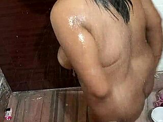 Black Indian lady sucks cock in bathroom with passion