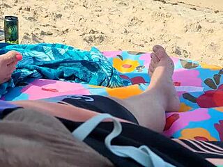 jerking him off on a public beach during holiday fun