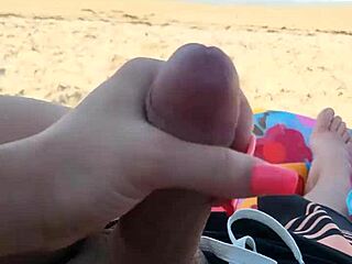 jerking him off on a public beach during holiday fun