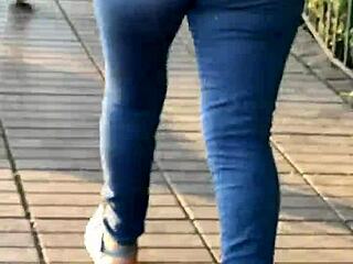 Curvy latina looks stunning in tight jeans at the party