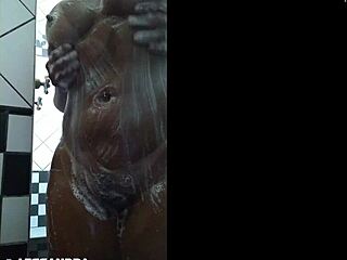 Alessanda Marques, a hot brunette, enjoys a solo shower scene