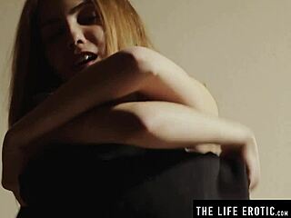 Ballgag muffles her cries while pleasuring herself