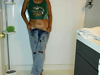 Latina wets jeans, strips panties, and showers off