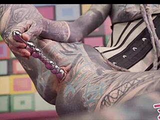 Anal queen Anuskatzz in corset plays with metal toy. She gets her ass fucked by big dick and squirts hard!