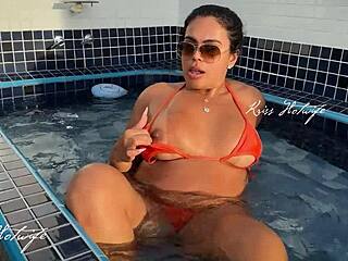 Married slut flaunts big ass and tanned curves by the rooftop pool.