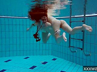 Beautiful russian girls enjoy swimming in the pool wearing bikinis