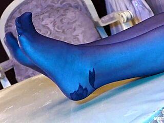 Sexy goddess in black pantyhose with rose print on heels teases you with her feet and toes