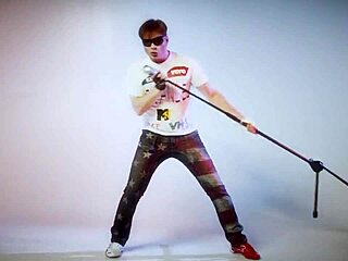 Alex Angel creates a sensual lesbian song with kissing and group intimacy.