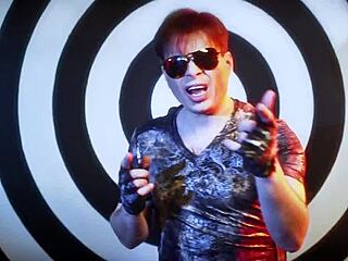 Alex Angel creates a sensual lesbian song with kissing and group intimacy.