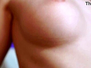 Pretty girl masturbates wet pussy with powerful vibrator in bathroom close up