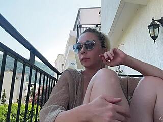 I flash my natural boobs topless on the balcony for public nudity thrill