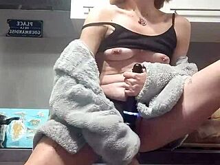 Redhead girlfriend dildos herself wildly on the counter