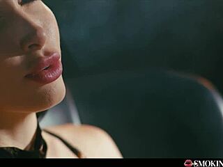 French brunette with huge fake tits masturbates while smoking cigarette and talking dirty