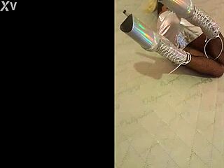 Total silver and fishnet pantyhose, wearing beautiful ankle boots with very high heels, silver black fishnet, she describes