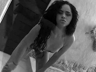 latina mom takes on double penetration in fishnets and heels on the bed, with anal fingering and gaping action leading to intense fucking