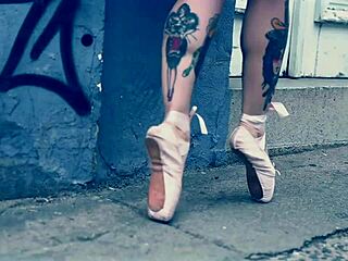 Ballerina in ballet shoes walks barefoot down the street