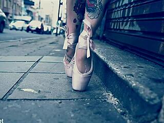 Ballerina in ballet shoes walks barefoot down the street