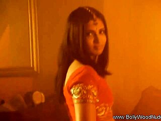 exotic brunette babe strips sensually letting passions rip clothes